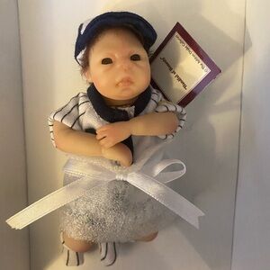Ashton Drake “Handful of Honesty” — mini collectible doll in baseball uniform.